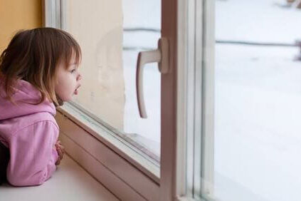 Child Looking out Window