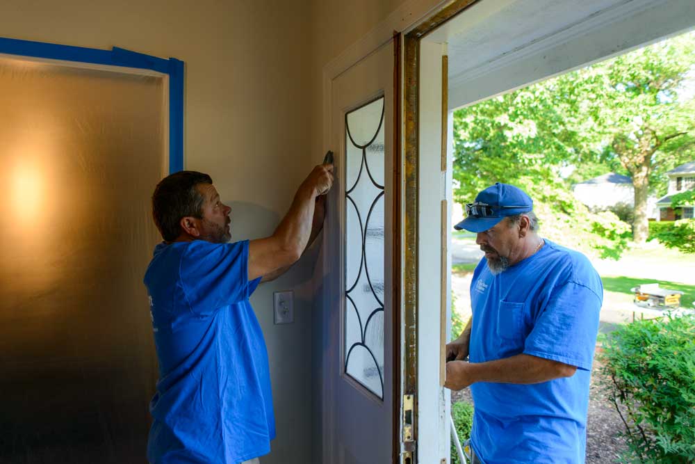 Before installing your new product, the old door and frame are carefully removed.