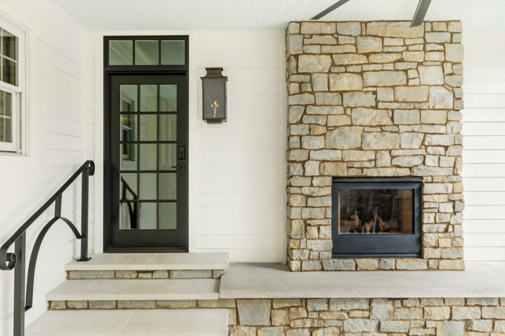 How To Choose A Patio Door 9 Single black french door next to outdoor fireplace