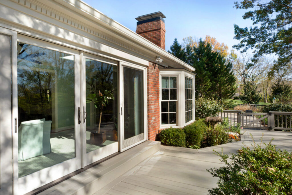 How To Choose A Patio Door 1 Outside on a deck looking at a patio door